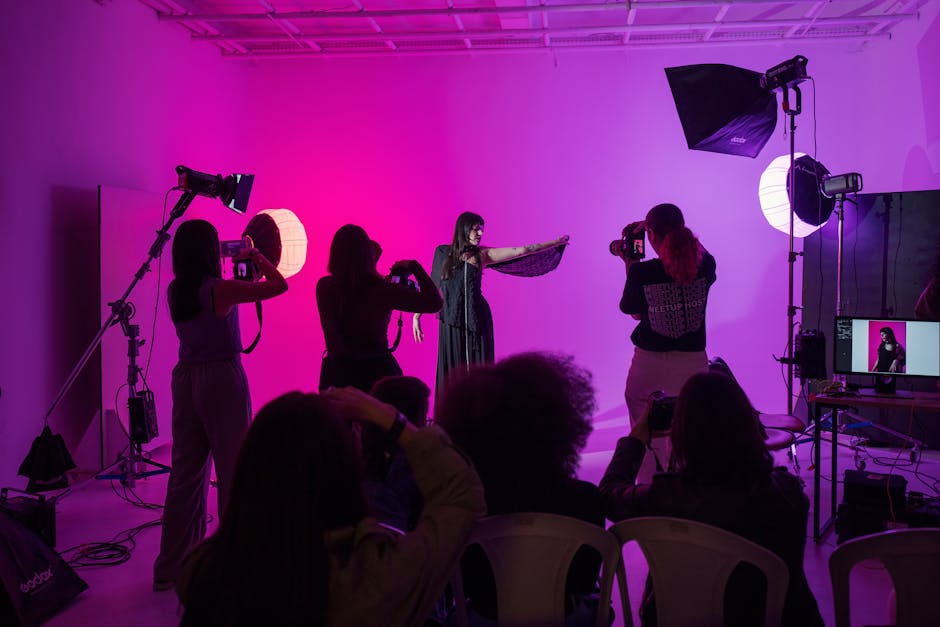 Capture of a live photography workshop with vibrant studio lighting and active participants.